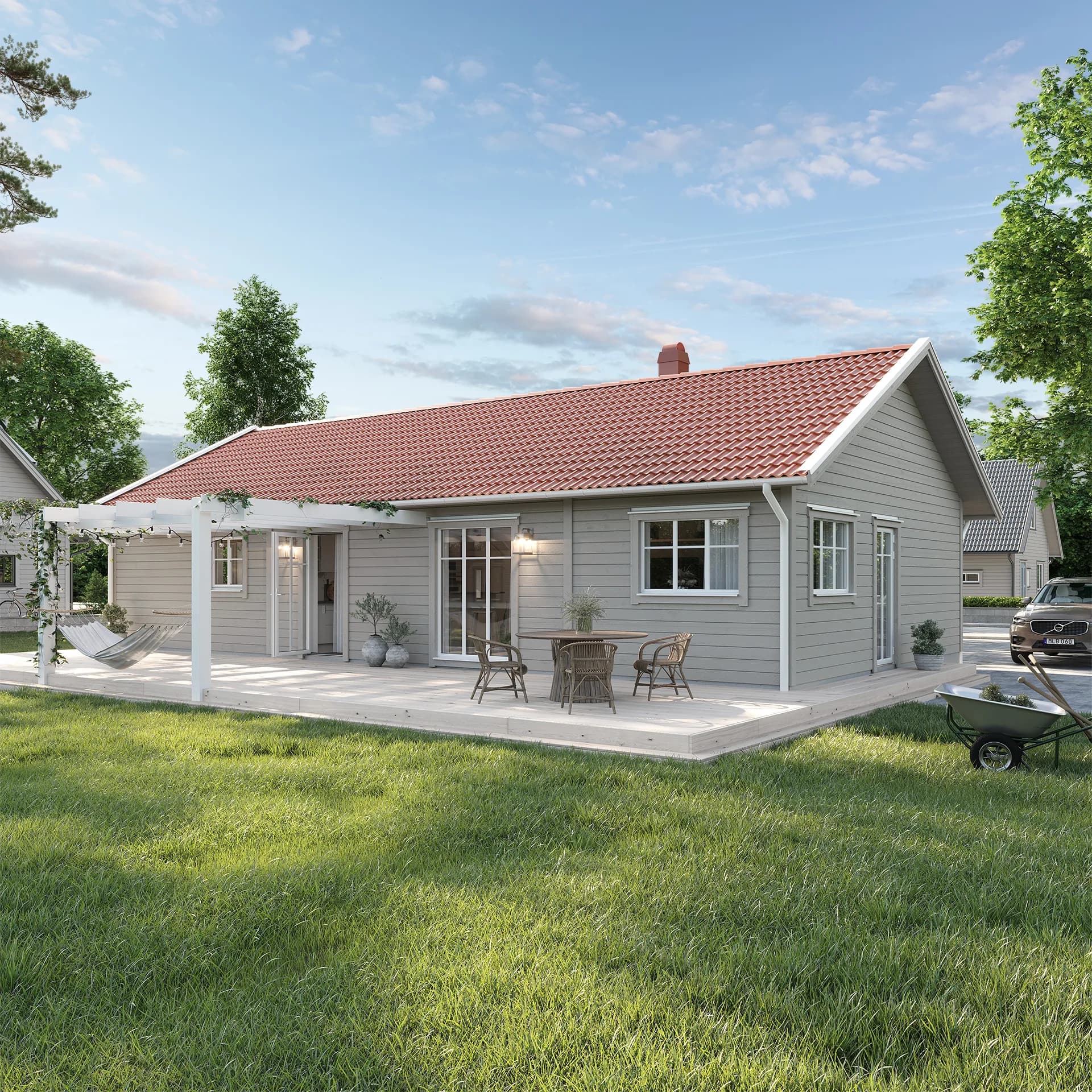 Grått Villa Nolvik med rött tak i klassisk stil med altan