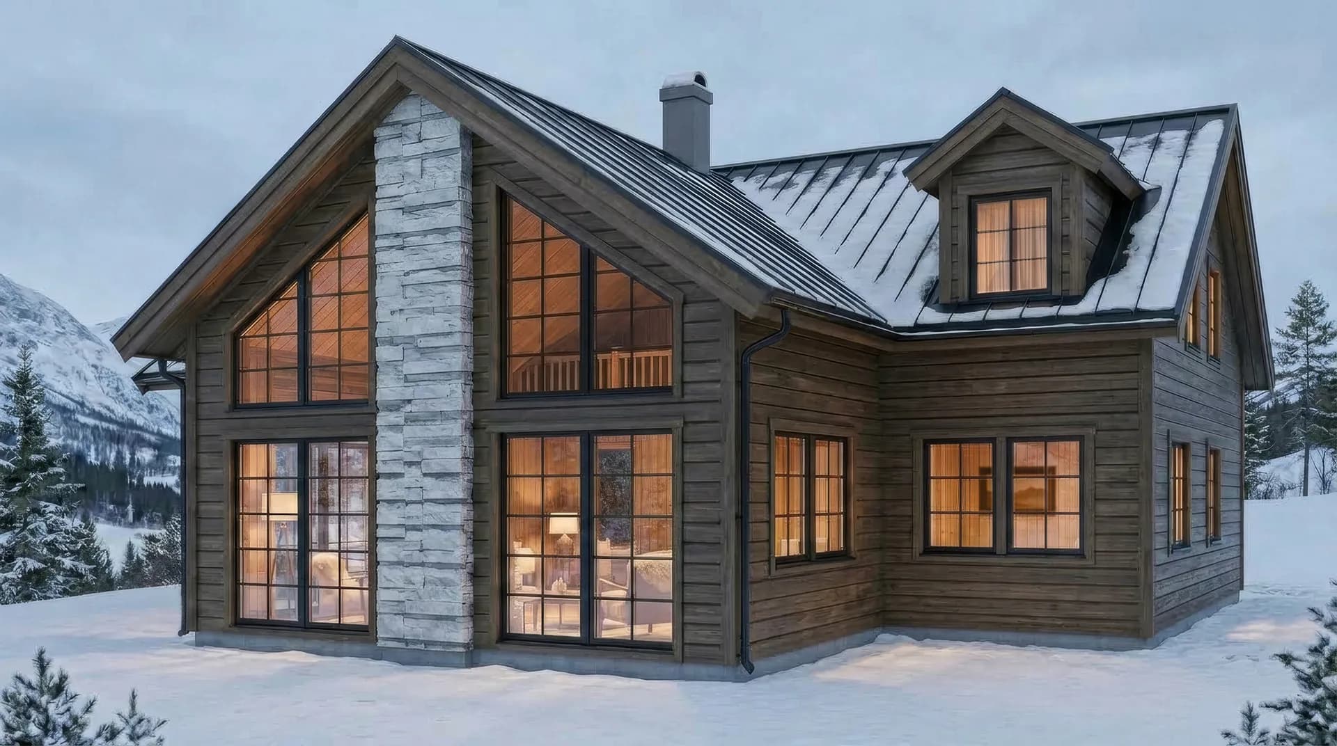 Lyxigt fjällhus i vinterlandskap – Granfjäll från Anderstam med mörkbrun panel, spröjsade fönster och snötäckt plåttak