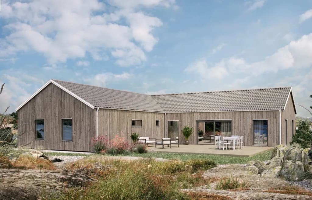 Villa Tylö enplanshus i vinkel med sadeltak och träpanel